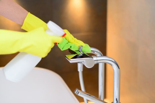 Window cleaner working on a residential property in NW5