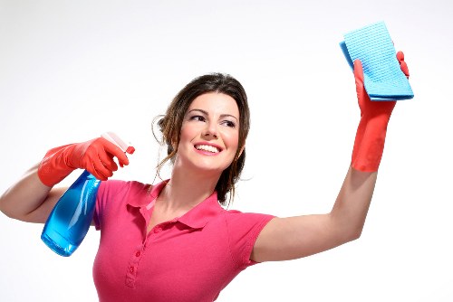 Cleaner in PPE carrying out a safe carpet cleaning service